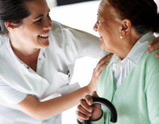 caregiver and elderly woman having conversation